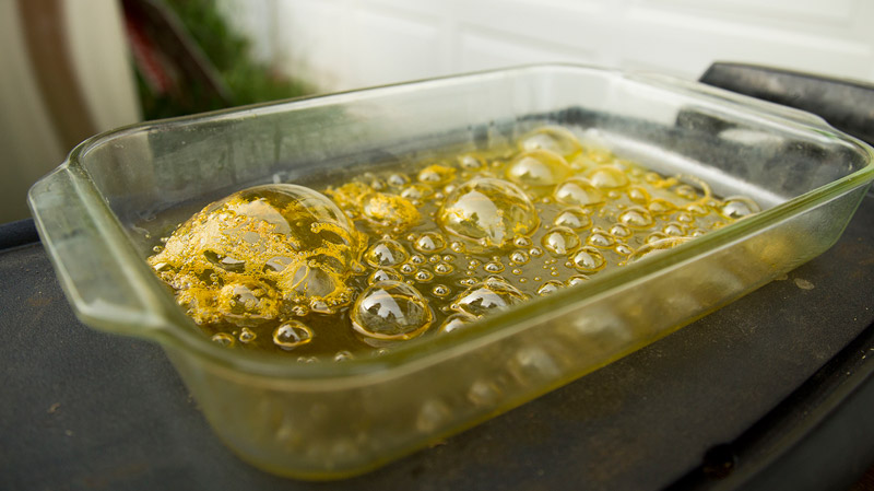 Hash oil bubbles up on a hot skillet Wednesday June 10, 2015 outside caregiver Devin Noonan’s home in Windsor, Maine. (Photo by Jessie Wardarski/News21)