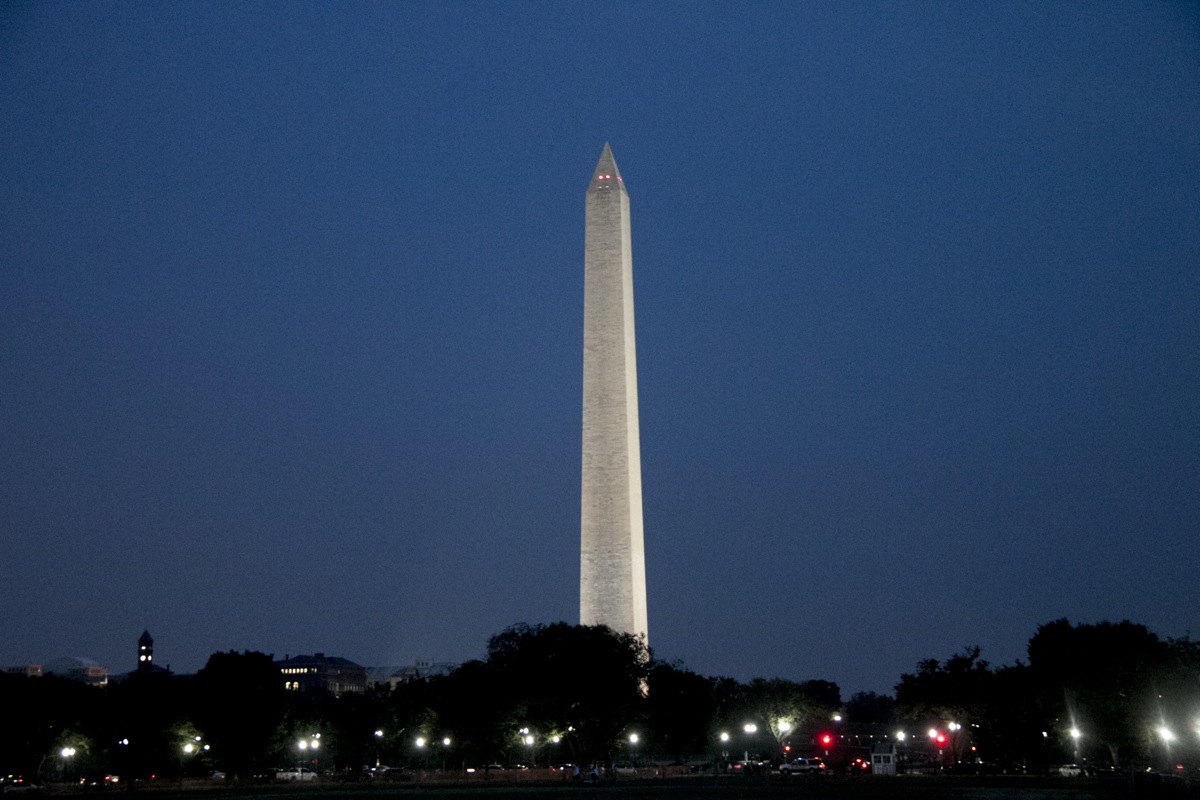 Washington Monument lit at night.